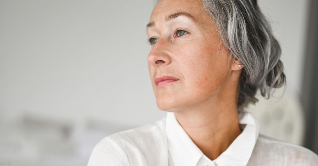 Mature woman looking off-camera (model)