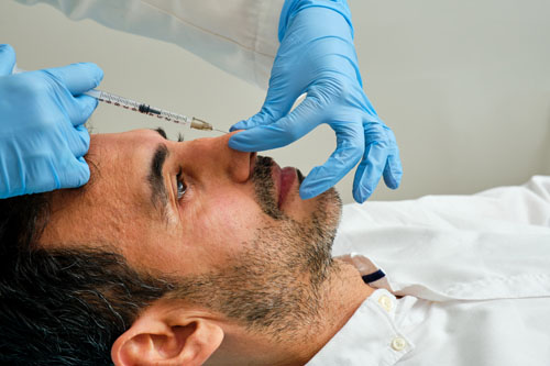 male patient who underwent a facial procedure by Dr. Jeffrey Roth, showing a significant improvement in his skin texture and tone.